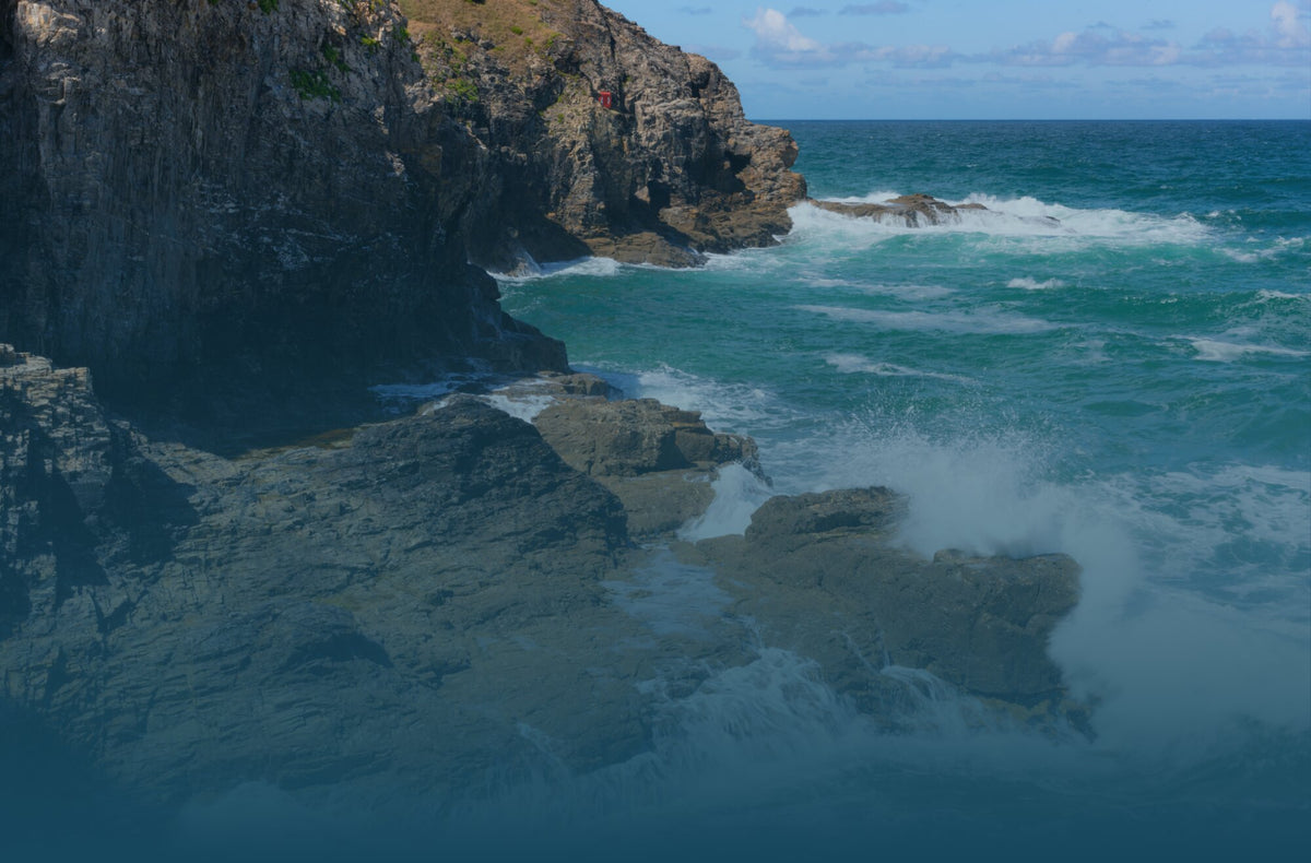 Waves breaking against the Cornish cliffs
